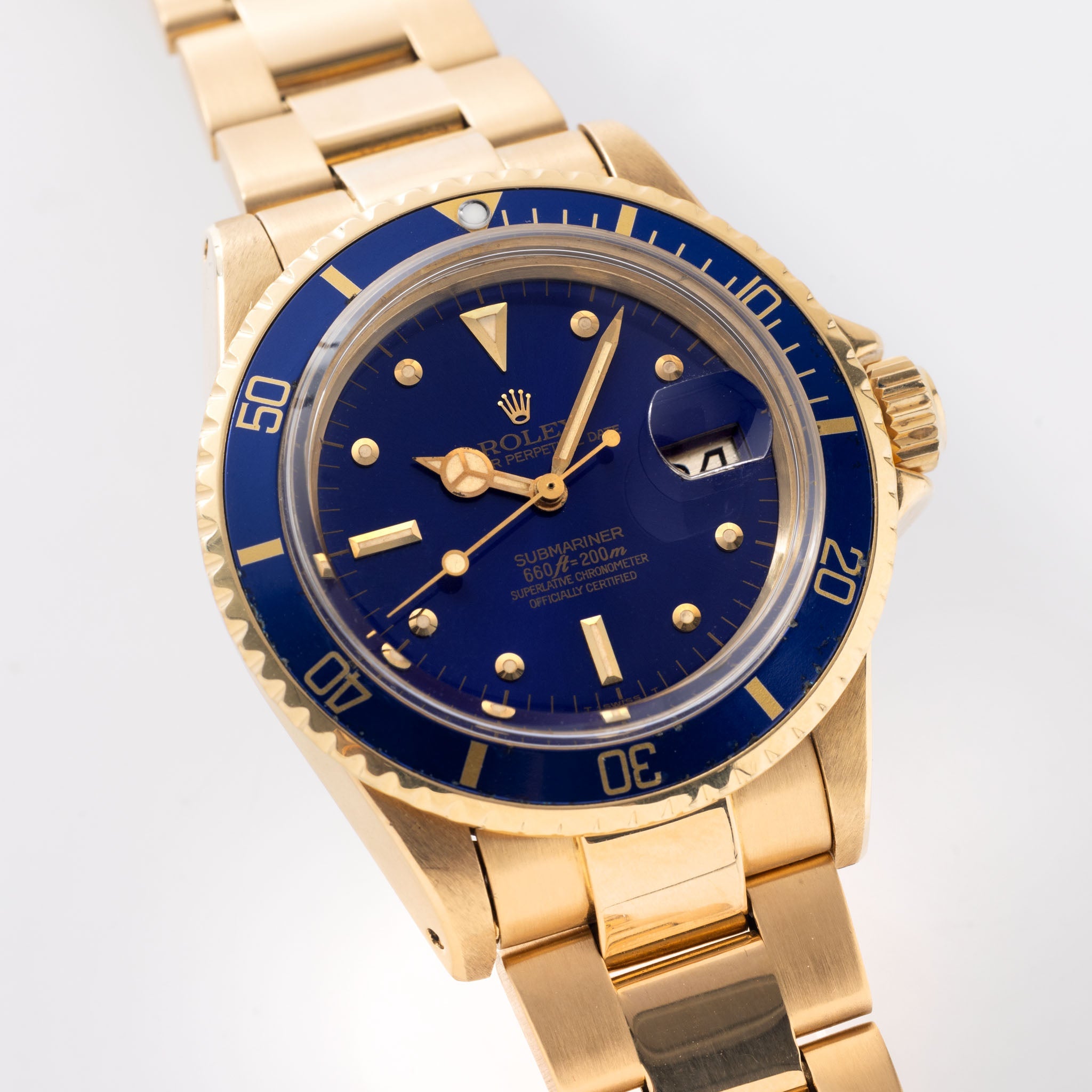 Rolex Submariner 1680/8 in 18k Yellow Gold with Blue "Nipple" Dial Turned Purple