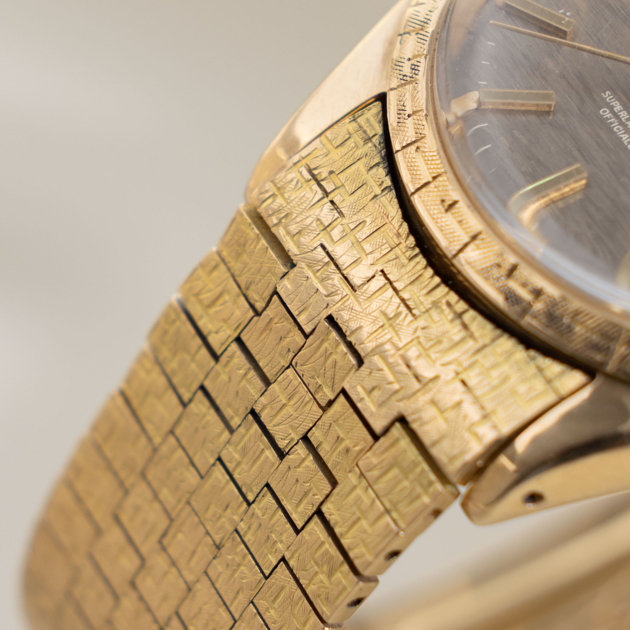 Rolex Oyster Perpetual Date 1504 Grey Shantung Dial Moreau Finish with Brick Bracelet in 18k Yellow Gold