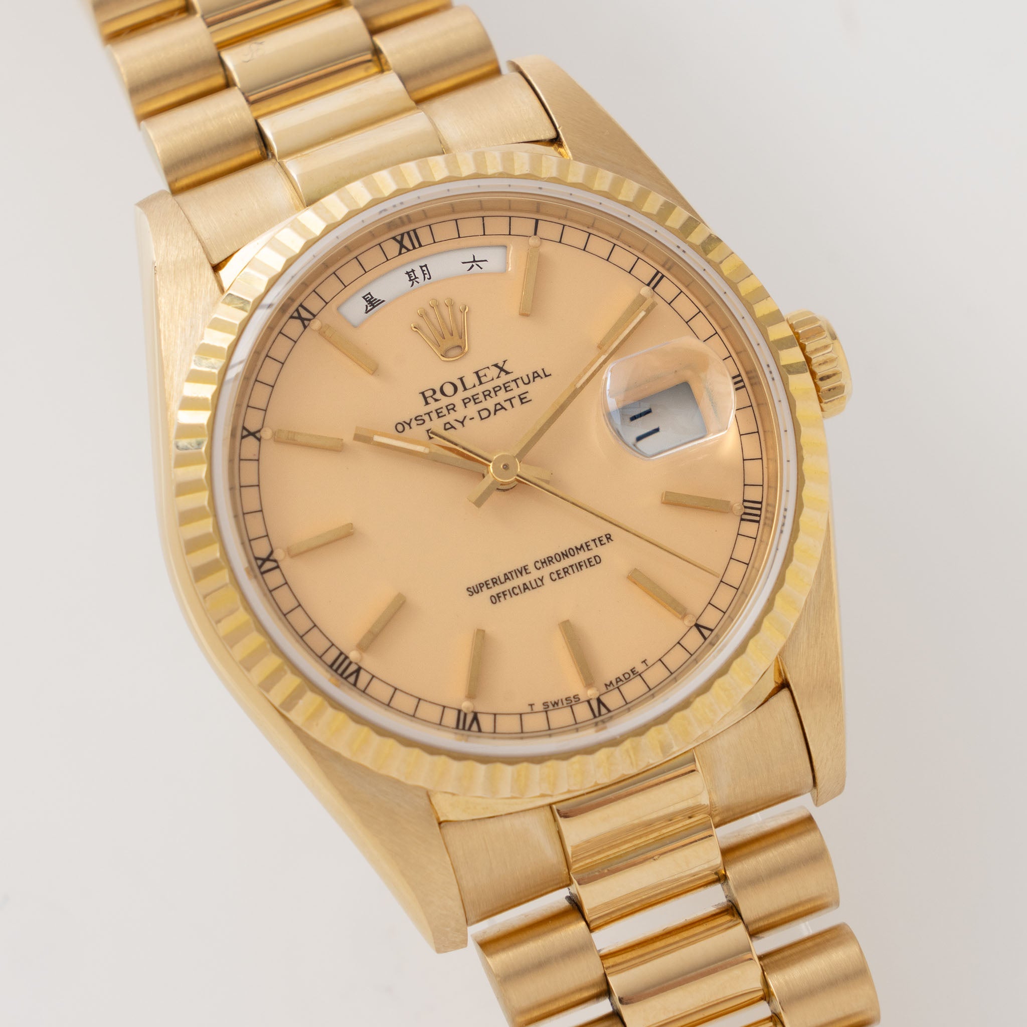 Rolex Day-Date 18238 rare Apricot Stella Dial with Original Guarantee paper in 18k yellow