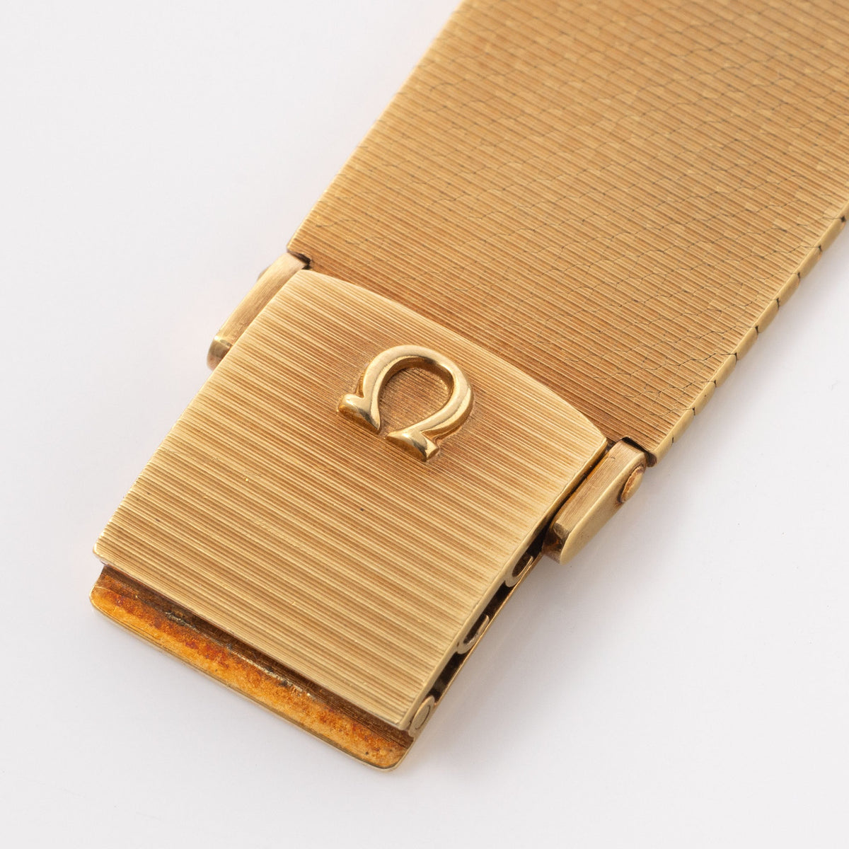 
Omega "State of Qatar" Squared Dresswatch Oxblood Stella-esque Dial from Original Owner Family in 18k yellow Gold with integrated Woven Bracelet 
