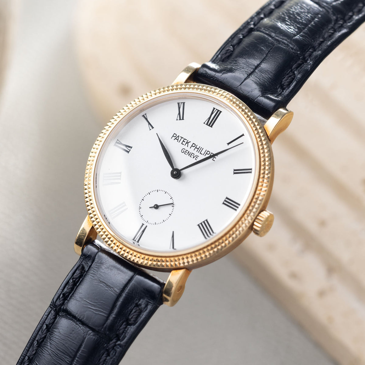 Patek Philippe Calatrava Ref 7119J 18k Yellow Gold Clous de Paris with White Roman Dial