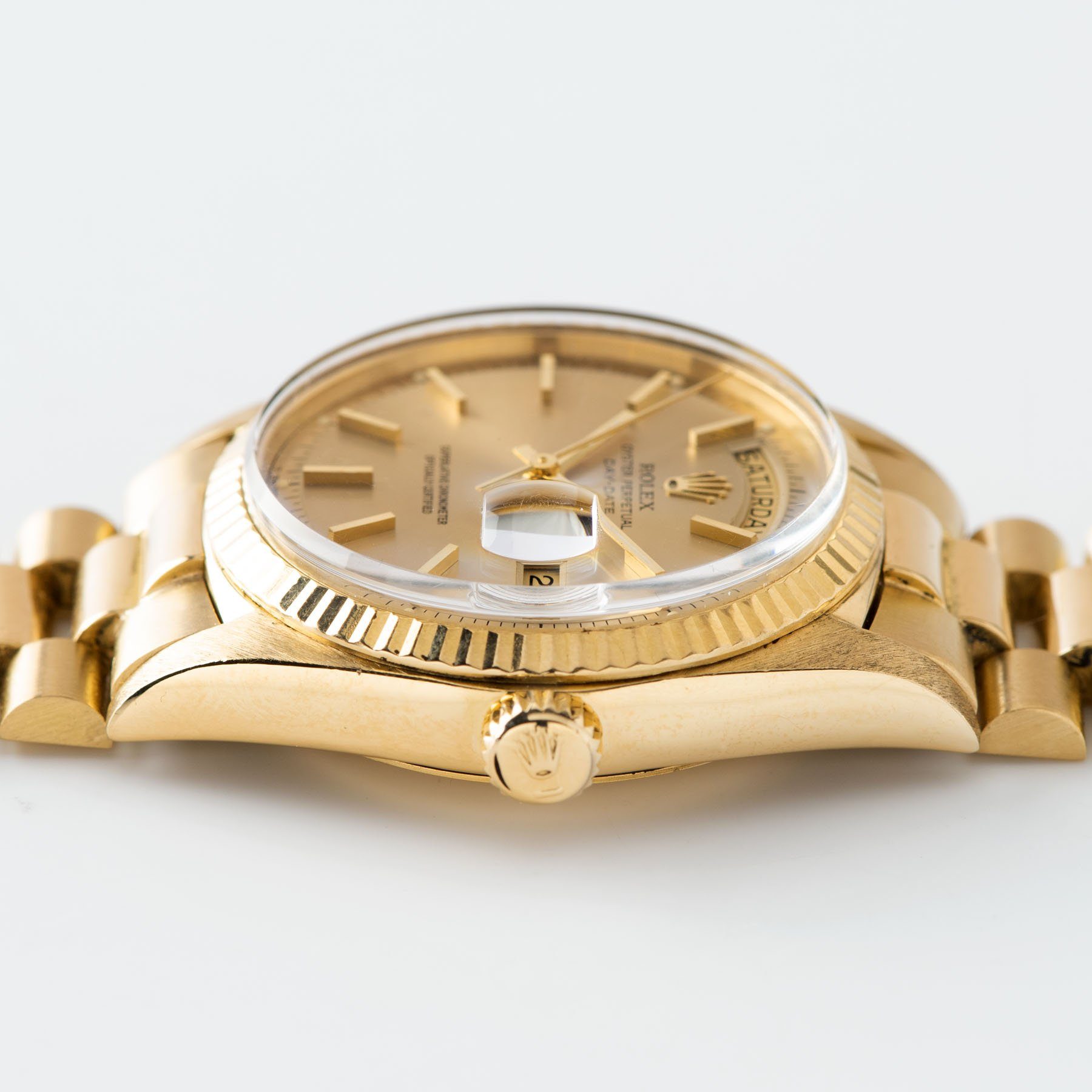 Rolex Day-Date Champagne Dial Yellow Gold 1803 cased detail with crown